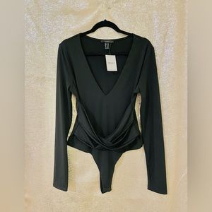 Body suit color black, size XL. NWT